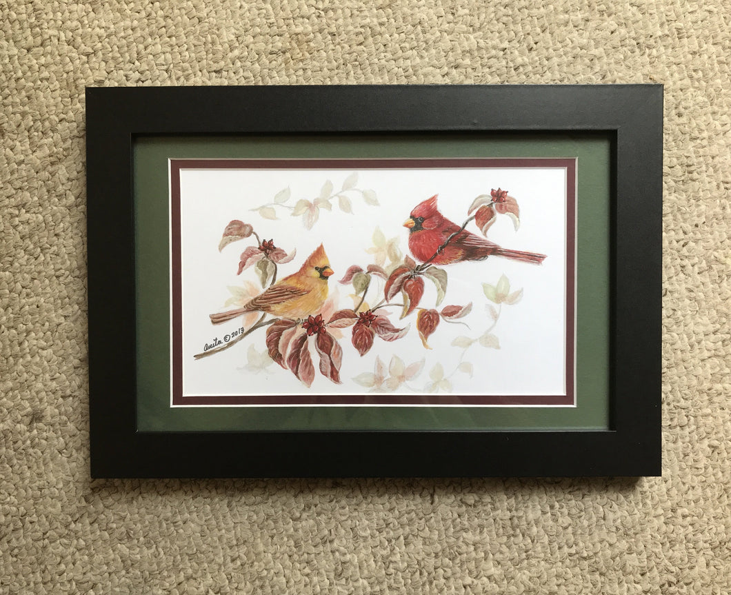 Cardinals matted in green with black frame