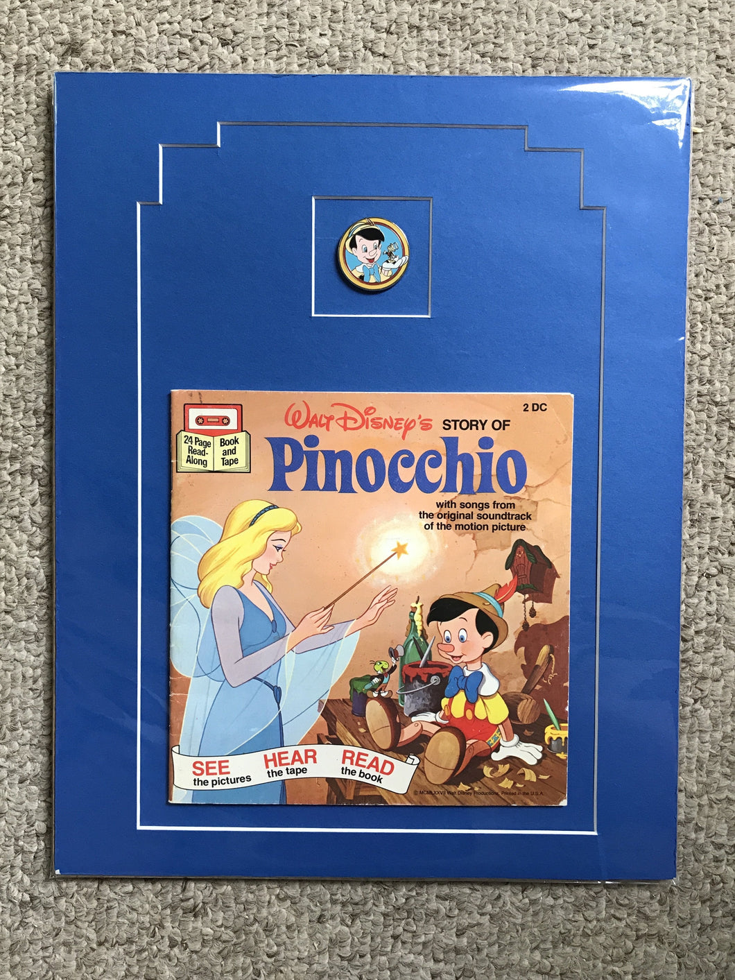 Pinocchio read along book from the 80’s and Disney collectors print.