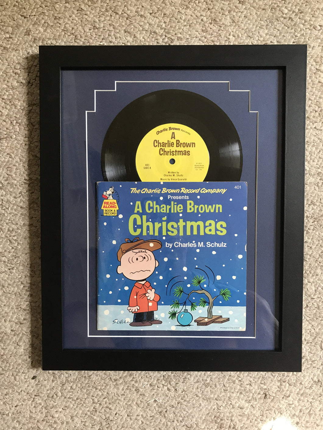 “A Charlie Brown Christmas” vintage record matted and framed.